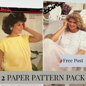 May include: A set of two vintage Robin paper knitting patterns featuring a yellow sleeveless top and a white short-sleeved textured sweater. The packaging displays the brand name Robin, the text Double Knitting, and size range 76-102 cm.