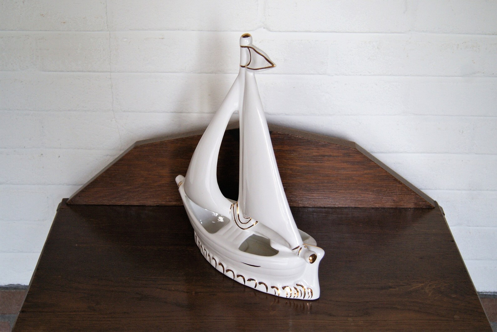 white ceramic sailboat