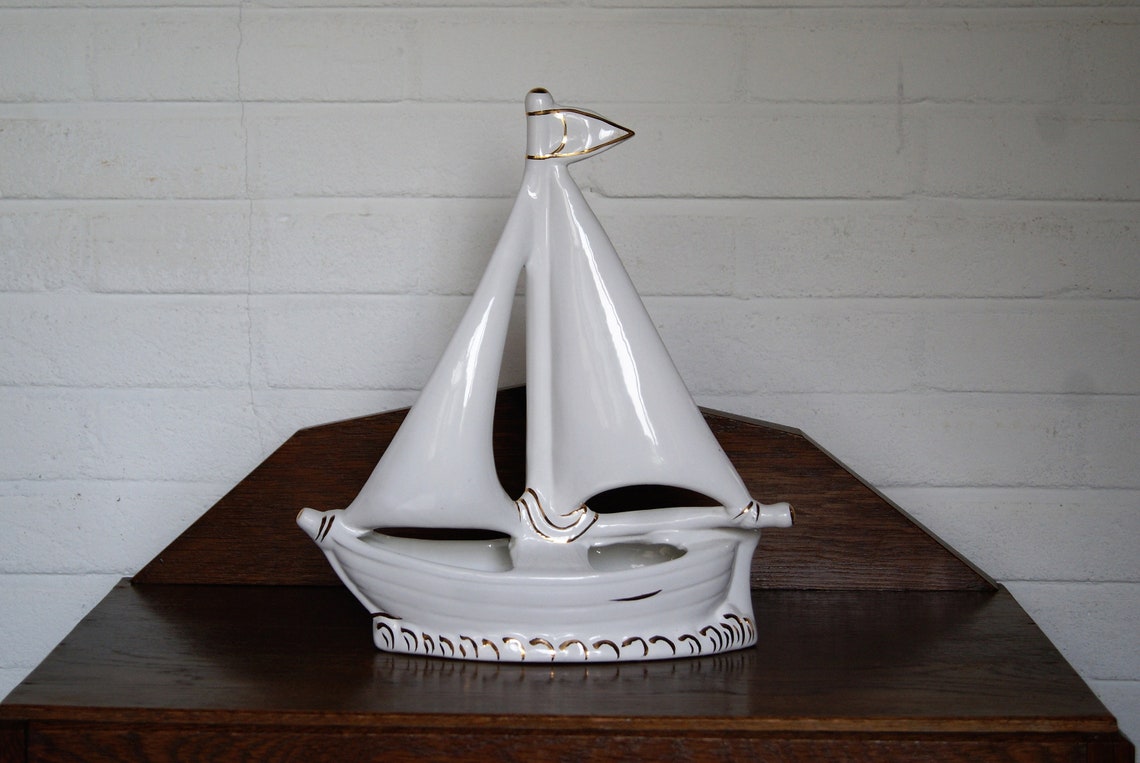 white ceramic sailboat