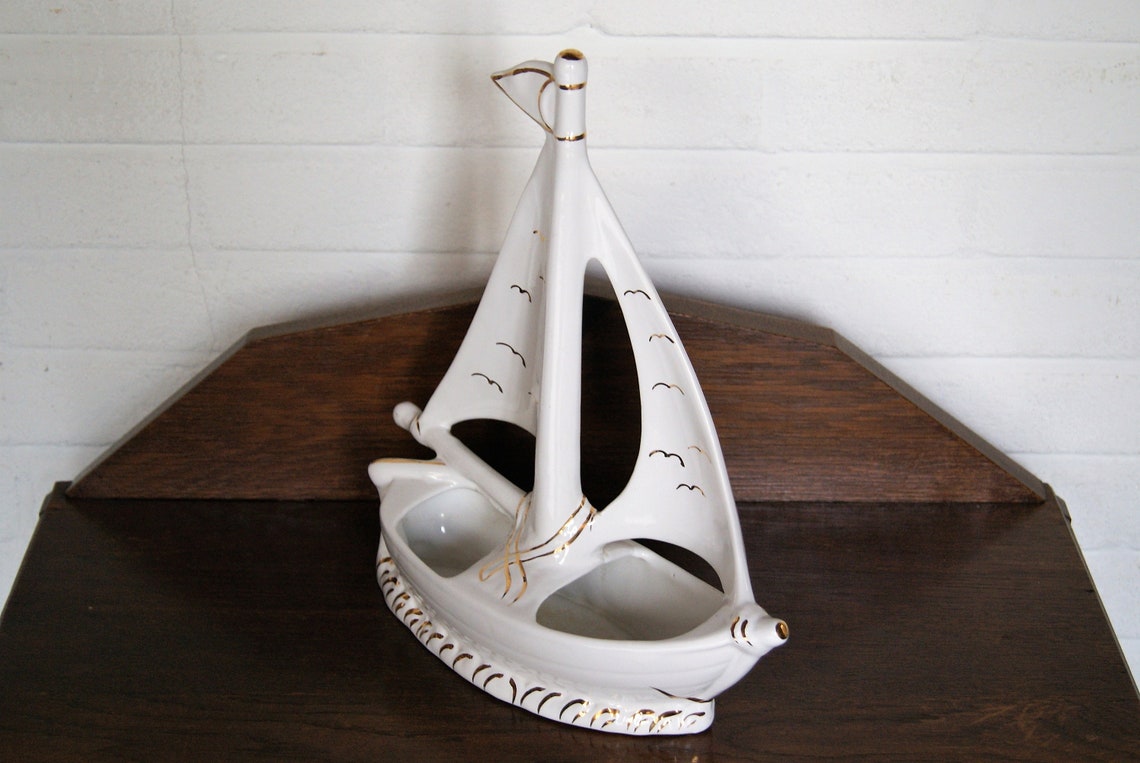 white ceramic sailboat