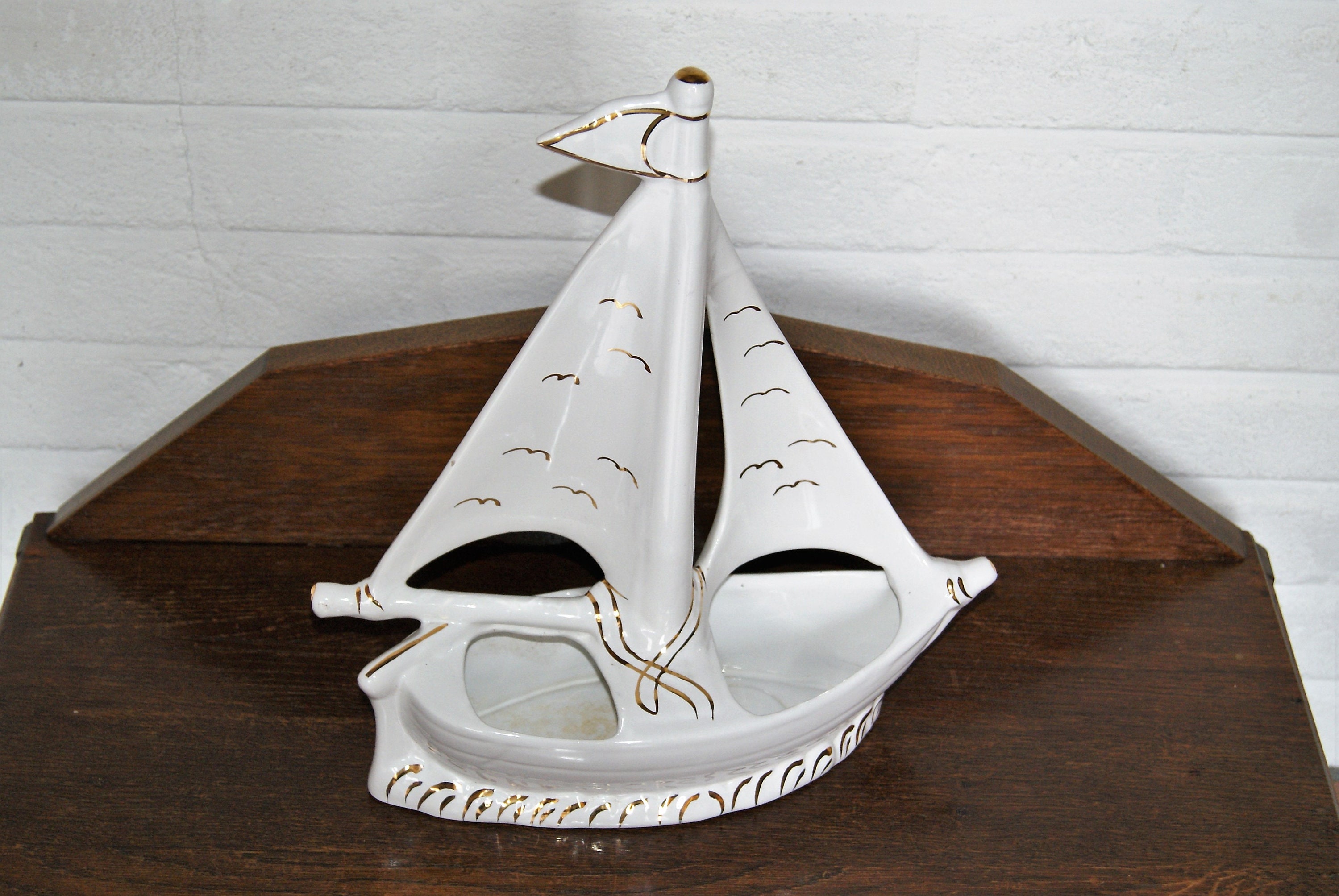 white ceramic sailboat