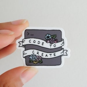 Puede incluir: Una pegatina gris con un símbolo de código, flores y el texto "Code to Create" en una pancarta blanca.
