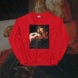 May include: Red sweatshirt with a painting of a woman holding a knife over a man lying in bed. The text "my villain era" is printed on the sweatshirt.