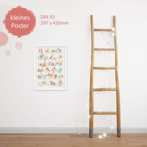 May include: A white framed poster with a colorful alphabet chart featuring animals. The poster is labeled "kleines Poster" and "DIN A3 297 x 420mm".