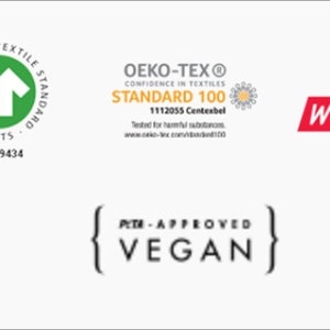 May include: A collection of green, red, and yellow certification labels. The labels include the Global Organic Textile Standard (GOTS), Oeko-Tex Standard 100, Fair Wear, and PETA-Approved Vegan.