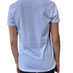 May include: A white short-sleeved t-shirt with a crew neck.