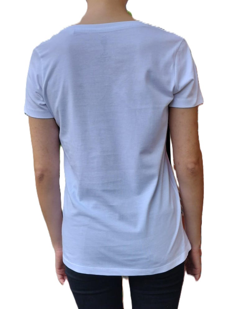 May include: A white short-sleeved t-shirt with a crew neck.