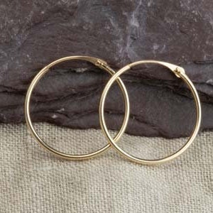 May include: A pair of gold hoop earrings. The earrings are simple and classic, and they would make a great gift for any occasion.