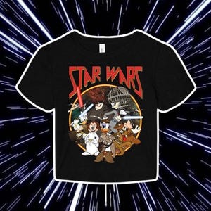 May include: Black t-shirt featuring a graphic of Mickey Mouse and his friends dressed as Star Wars characters. The graphic includes the text "STAR WARS" in a metallic font.