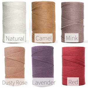 May include: Six spools of cotton rope in different colors: natural, camel, mink, dusty rose, lavender, and red.