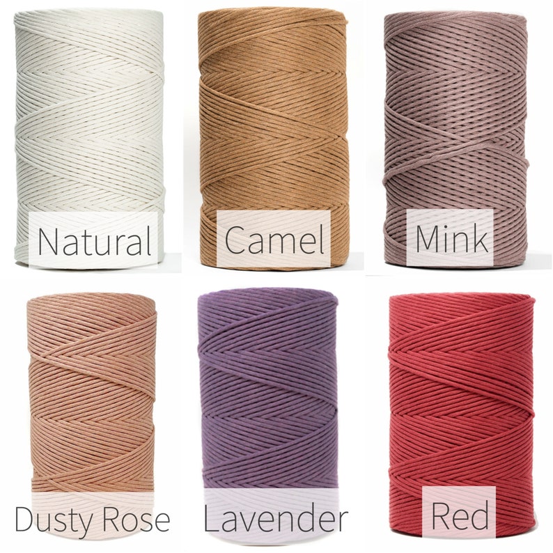 May include: Six spools of cotton rope in different colors: natural, camel, mink, dusty rose, lavender, and red.