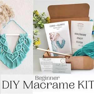 May include: A beginner macrame kit with teal cord, a wooden dowel, and instructions. The kit includes a pattern for a macrame wall hanging.