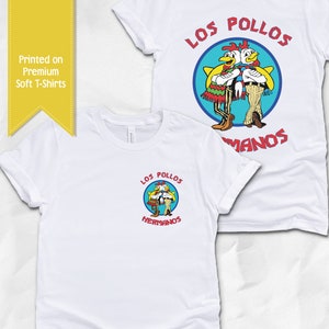 May include: White t-shirts with the "Los Pollos Hermanos" logo. The logo features two cartoon chickens in a blue circle with red text. The shirts are printed on premium soft material. The text "Printed on Premium Soft T-Shirts" is also visible.