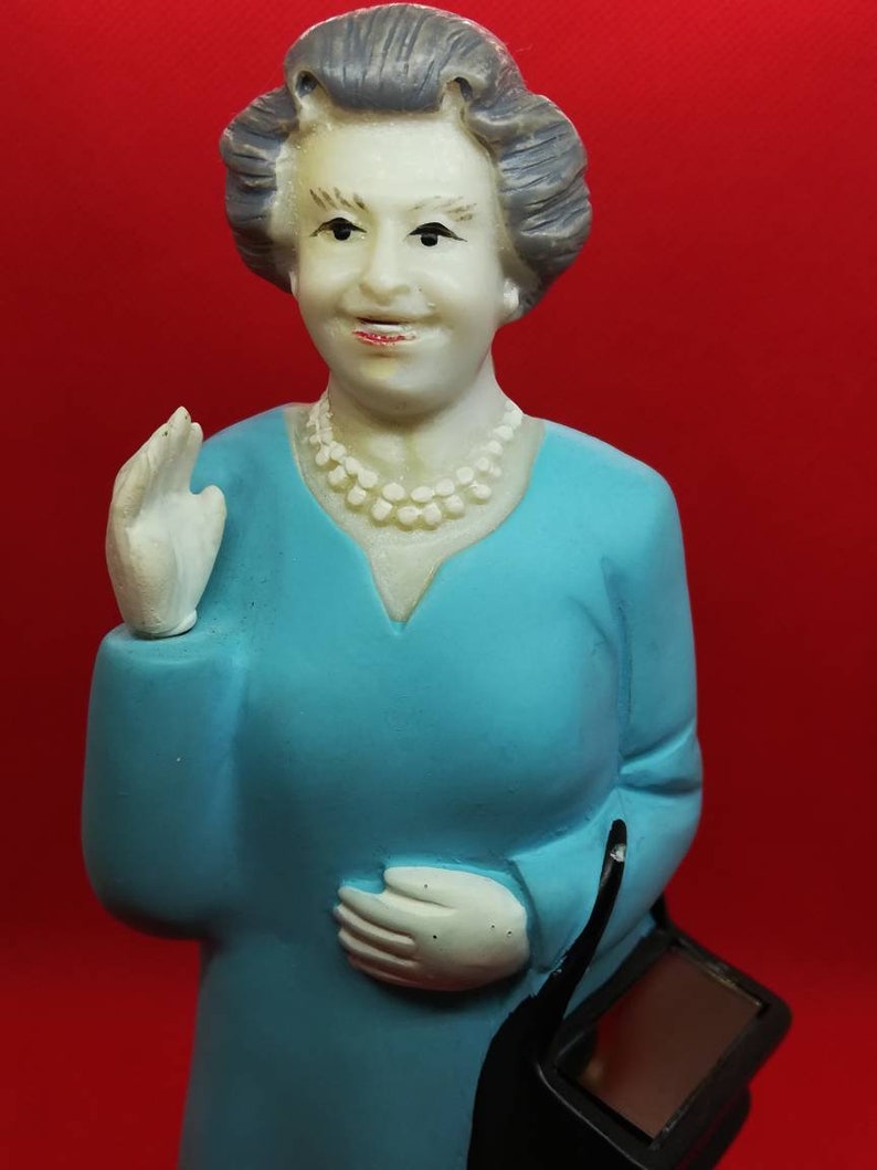 Solar power waving queen Elizabeth