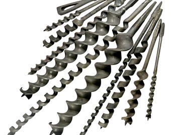 May include: A collection of antique auger drill bits, arranged diagonally against a white background. The bits are made of dark metal and feature a spiral design for boring holes. The collection includes bits of various sizes and shapes, showcasing their historical craftsmanship.