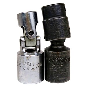 May include: Two metal universal joint sockets. One is silver with "16 MAC XU USA" stamped on it. The other is dark gray with "18 MAC XU USA" stamped on it. Both are angled.