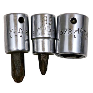 May include: Three chrome MAC USA socket tools. The tools include a Phillips head screwdriver bit and two sockets. The sockets are labeled 8, 5/8, and 9.5. The tools are on a white background.