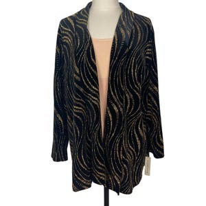 May include: Black velvet cardigan with a gold wavy pattern. The cardigan has a shawl collar and is open in the front. The brand name "No Boundaries" is visible on the tag.