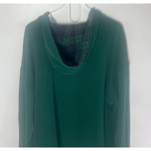 May include: A solid dark green long-sleeve hooded sweatshirt featuring a hood lined with a dark green and navy blue plaid pattern. The garment is displayed on a white hanger and features a standard hood construction with long sleeves.