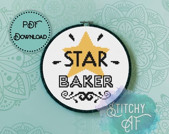 May include: A cross-stitch embroidery hoop with the words "STAR BAKER" and a gold star design. The text is in black, with a decorative border at the bottom. A PDF download graphic is in the upper left corner.