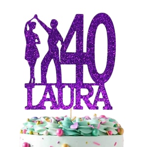 May include: Purple glitter cake topper with a dancing couple silhouette, the number 40, and the name "LAURA". The topper is on a cake with blue and white frosting and colorful sprinkles. A separate white square topper with gold stars and the text "Ooh Let's Party" is on the cake.