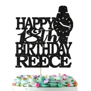 May include: Black glitter cake topper with the text "Happy 18th Birthday Reece" and a watch design. A separate white square cake topper with gold glitter text reads "Ooh Let's Party".