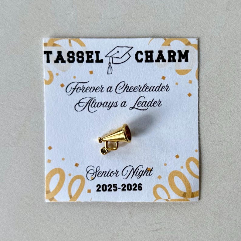Cheerleader tassel charm graduation keepsake for team banquets senior night or cheer awards designed as a team spirit jewelry accent for girls teens or coaches stylish accessory for tassel keychain or backpack charm for cheerleaders personalized graduation gift idea for teen athletes cheerleaders or cheer moms celebrating end of season or senior year milestones