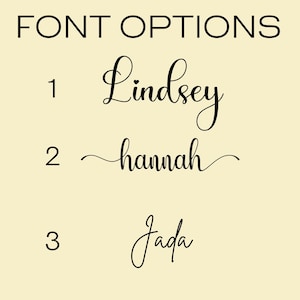 May include: A cream-colored background displays the text "FONT OPTIONS" in black. Below, three font choices are presented: "Lindsey," "hannah," and "Jada," each in a different elegant script style, numbered 1, 2, and 3 respectively.