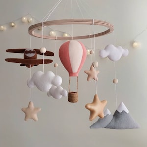 Travel nursery mobile. Adventure baby room decor. Baby girl crib mobile. Airplane, pink hot air balloon, mountain cot mobile. Musical mobile