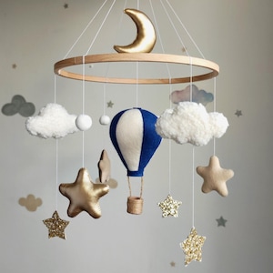 Hot air balloon baby mobile. Hot air balloon nursery decor. Crib mobile with Wicker balloon, boucle clouds. Travel theme, adventure nursery.