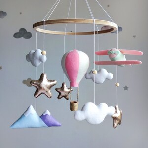 Travel nursery mobile. Adventure baby room decor. Baby girl crib mobile. Airplane, pink hot air balloon, mountain cot mobile. Musical mobile