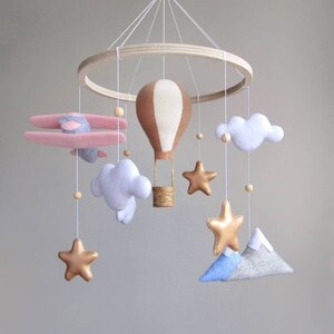 Travel nursery mobile. Adventure baby room decor. Baby girl crib mobile. Pink airplane, hot air balloon, mountain cot mobile. Musical mobile