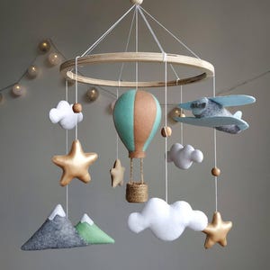 Travel nursery mobile. Adventure baby room decor. Baby boy girl crib mobile. Airplane, hot air balloon, mountain cot mobile. Musical mobile.