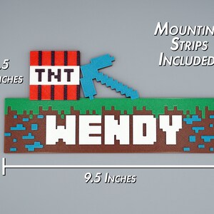 May include: A Minecraft-themed nameplate with the name "WENDY" in white pixelated letters. The nameplate is brown with green grass and blue water blocks. A red TNT block with a pickaxe is on the left side of the nameplate. The nameplate is 9.5 inches wide and 4.5 inches tall. Mounting strips are included.