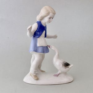 Vintage porcelain figurine &quot;girl with a goose&quot;, Girl in a blue dress running away from a goose, Porcelain figurine Germany
