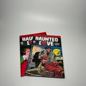 May include: Two vintage horror comic books titled "Haunted Love" with a red and black color scheme. The covers feature illustrations of a man and a zombie, and a man with his mouth taped shut. The comics are from "The Chilling Archives of Horror Comics."