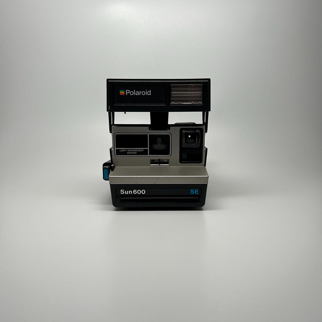 Vintage Polaroid Sun 600 LMS, appareil photo avec sangle