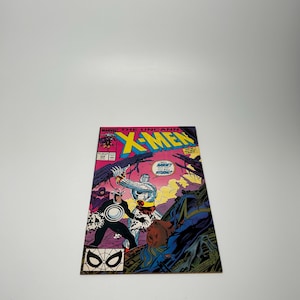 May include: A comic book cover featuring the X-Men. The cover is pink, blue, and black with a white and gray image of the X-Men characters. The title of the comic book is "The Uncanny X-Men".