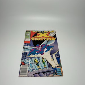 May include: A Marvel X-Factor comic book titled The Fall of the Mutants, featuring a colorful illustration of a winged character flying above three figures in uniform, with a large yellow X-Factor logo and a barcode visible in the bottom left corner.