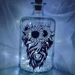Highland cow LED bottle lamp, Scottish Highlands.