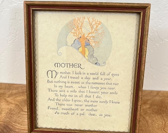 May include: Framed artwork with a poem about a mother. The frame is brown with a burgundy inner border. The artwork features a stylized illustration and the word "MOTHER" at the top. The poem is written in black ink.
