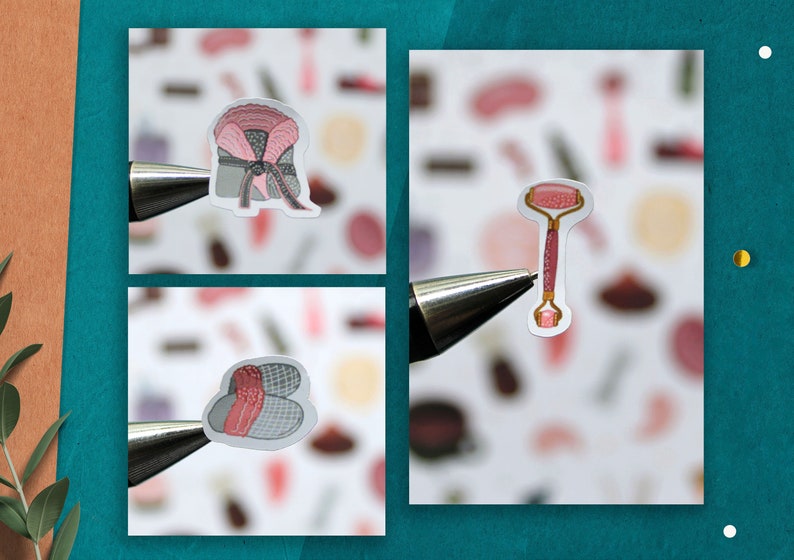 May include: Three stickers featuring beauty and self-care items. The first sticker shows a pink and gray headband with a bow. The second sticker shows a pink and gold facial roller. The third sticker shows a pair of pink and gray slippers.