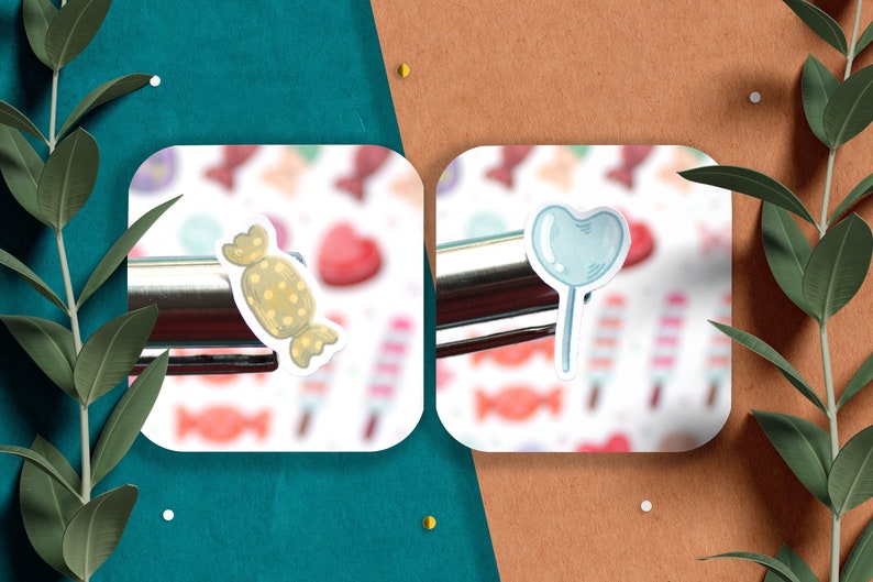 May include: Two white square stickers with a colorful candy background. The left sticker features a cartoon illustration of a yellow and brown wrapped candy. The right sticker features a cartoon illustration of a blue heart-shaped lollipop.