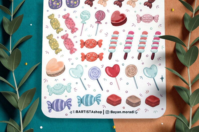 May include: A sheet of colorful stickers featuring various candy designs, including lollipops, hearts, and wrapped candies. The stickers are perfect for adding a touch of sweetness to planners, journals, and other craft projects.