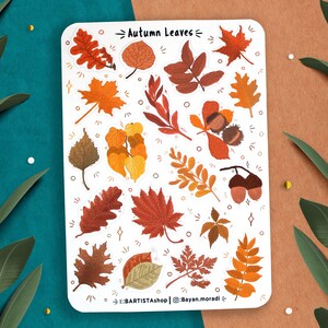 May include: A sheet of stickers featuring various autumn leaves in shades of orange, red, yellow, and brown. The stickers are arranged in a random pattern on a white background. The text "Autumn Leaves" is printed at the top of the sheet. The text "@Bayan.moradi" is printed at the bottom of the sheet.