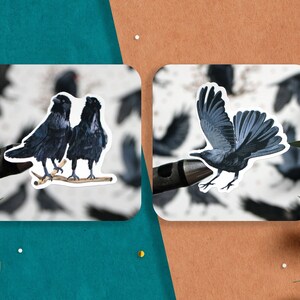 May include: Two black ravens perched on a branch, and a single black raven in flight. All three ravens are depicted against a white background with a blurred image of many ravens in the background.