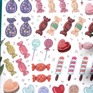 May include: A sheet of colorful candy stickers with various shapes and designs, including lollipops, hearts, and wrapped candies. The stickers are perfect for adding a touch of sweetness to planners, journals, and other craft projects.