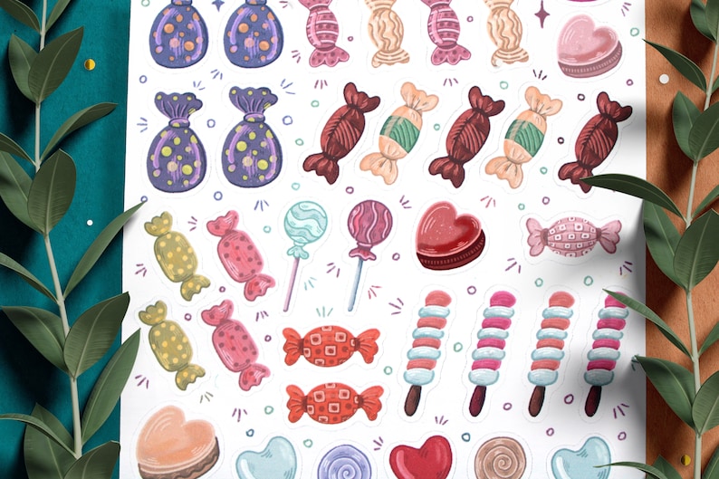 May include: A sheet of colorful candy stickers with various shapes and designs, including lollipops, hearts, and wrapped candies. The stickers are perfect for adding a touch of sweetness to planners, journals, and other craft projects.