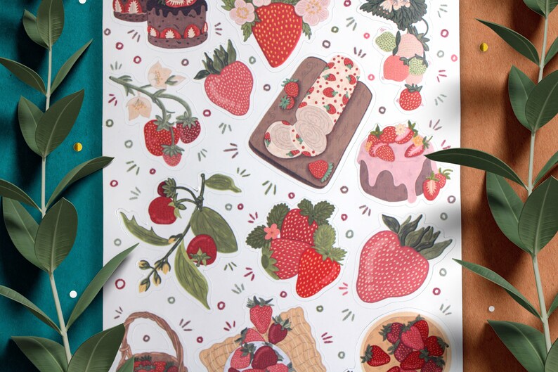 May include: A sheet of stickers featuring various illustrations of strawberries, cakes, and other sweet treats. The stickers are in a white background with a variety of colors, including red, pink, green, and brown.