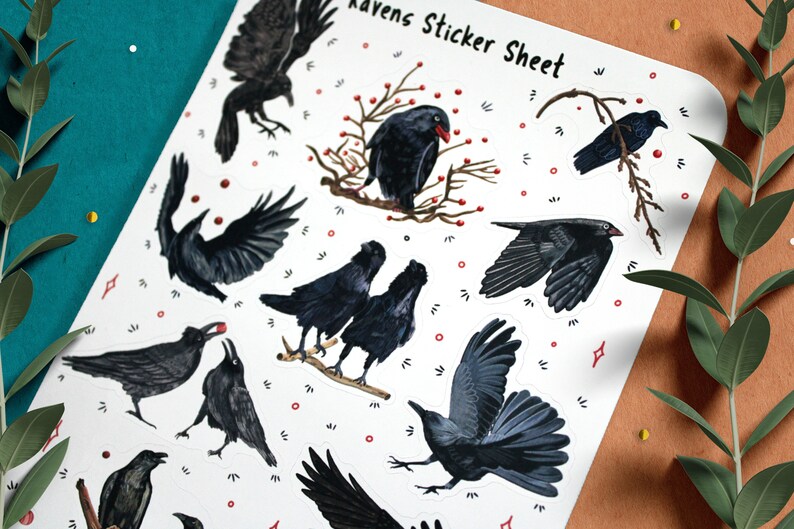 May include: A sticker sheet with a white background and black ravens in various poses. The sheet is titled "Ravens Sticker Sheet".